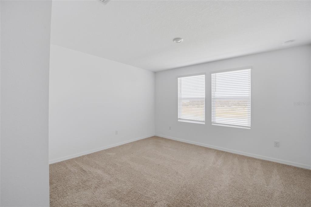 2407 Paravane Way Wesley Chapel, FL 33543 - Photo 22 of 32 an empty room with a window