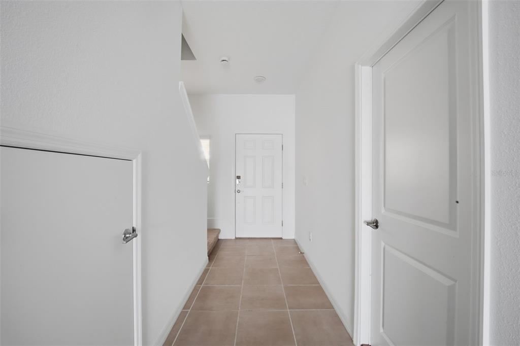 2407 Paravane Way Wesley Chapel, FL 33543 - Photo 26 of 32 a view of a hallway with wooden floor