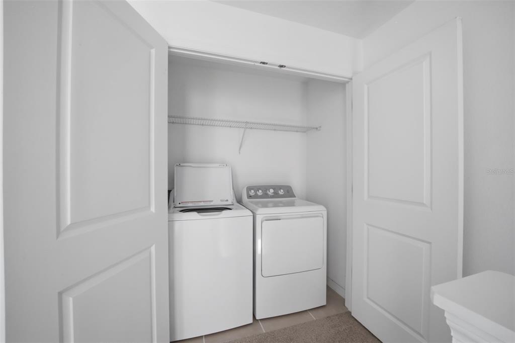 2407 Paravane Way Wesley Chapel, FL 33543 - Photo 27 of 32 a utility room with dryer and washer