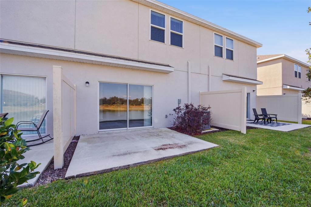 2407 Paravane Way Wesley Chapel, FL 33543 - Photo 28 of 32 a view of a backyard with a garden and plants