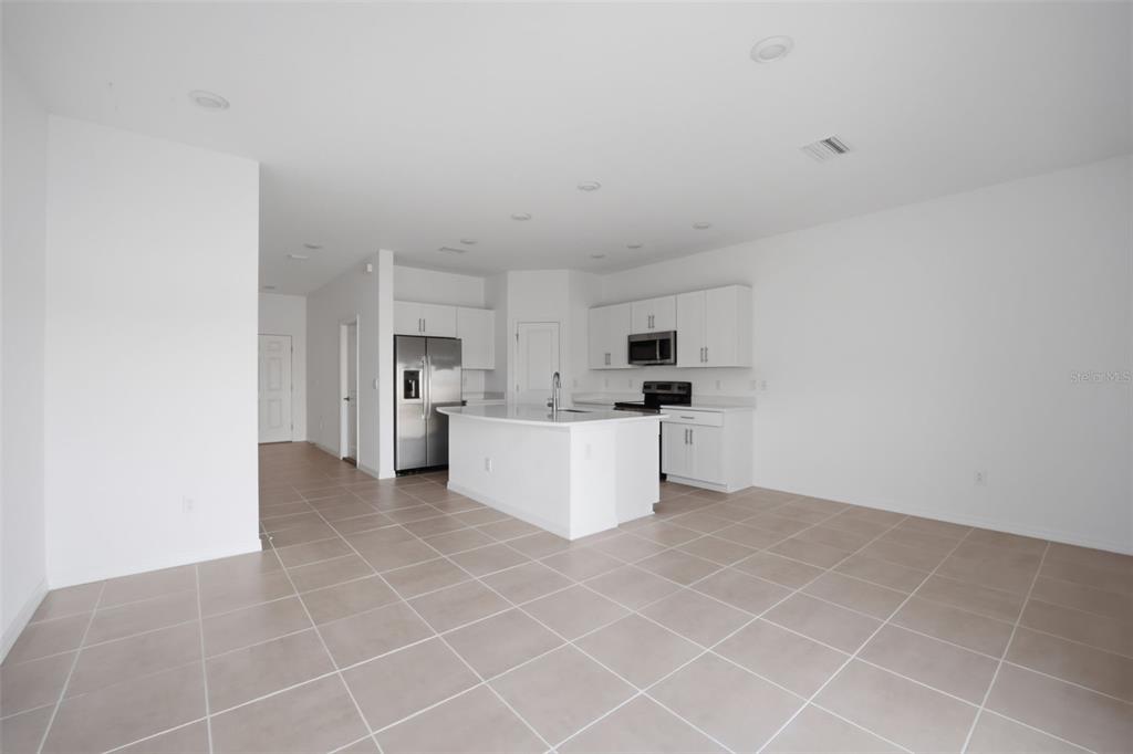 2407 Paravane Way Wesley Chapel, FL 33543 - Photo 7 of 32 a view of kitchen with furniture and cabinets