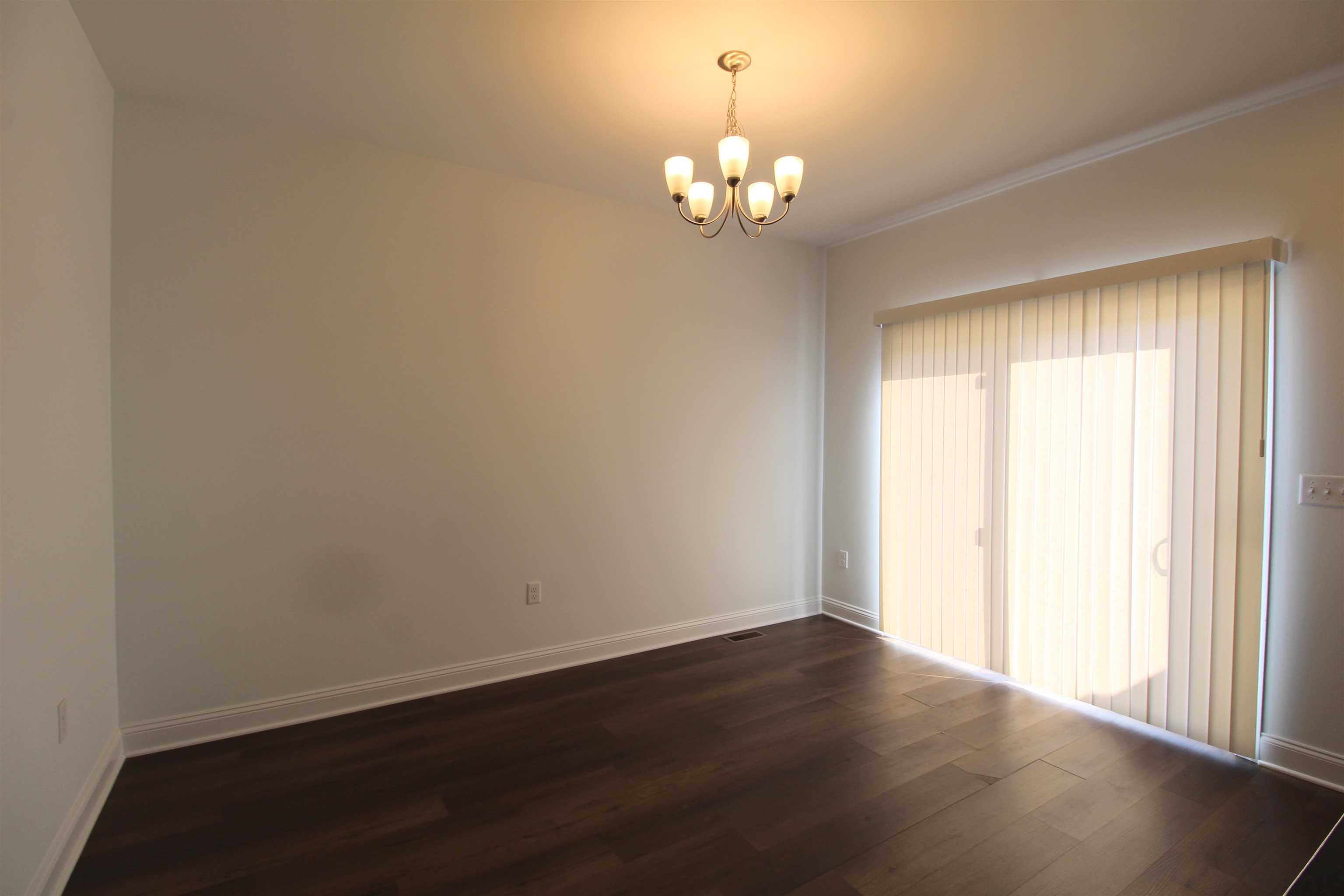 1145 Bluemoon Drive Harrisonburg, VA 22801 - Photo 13 of 18 a view of a livingroom with wooden floor and a large window
