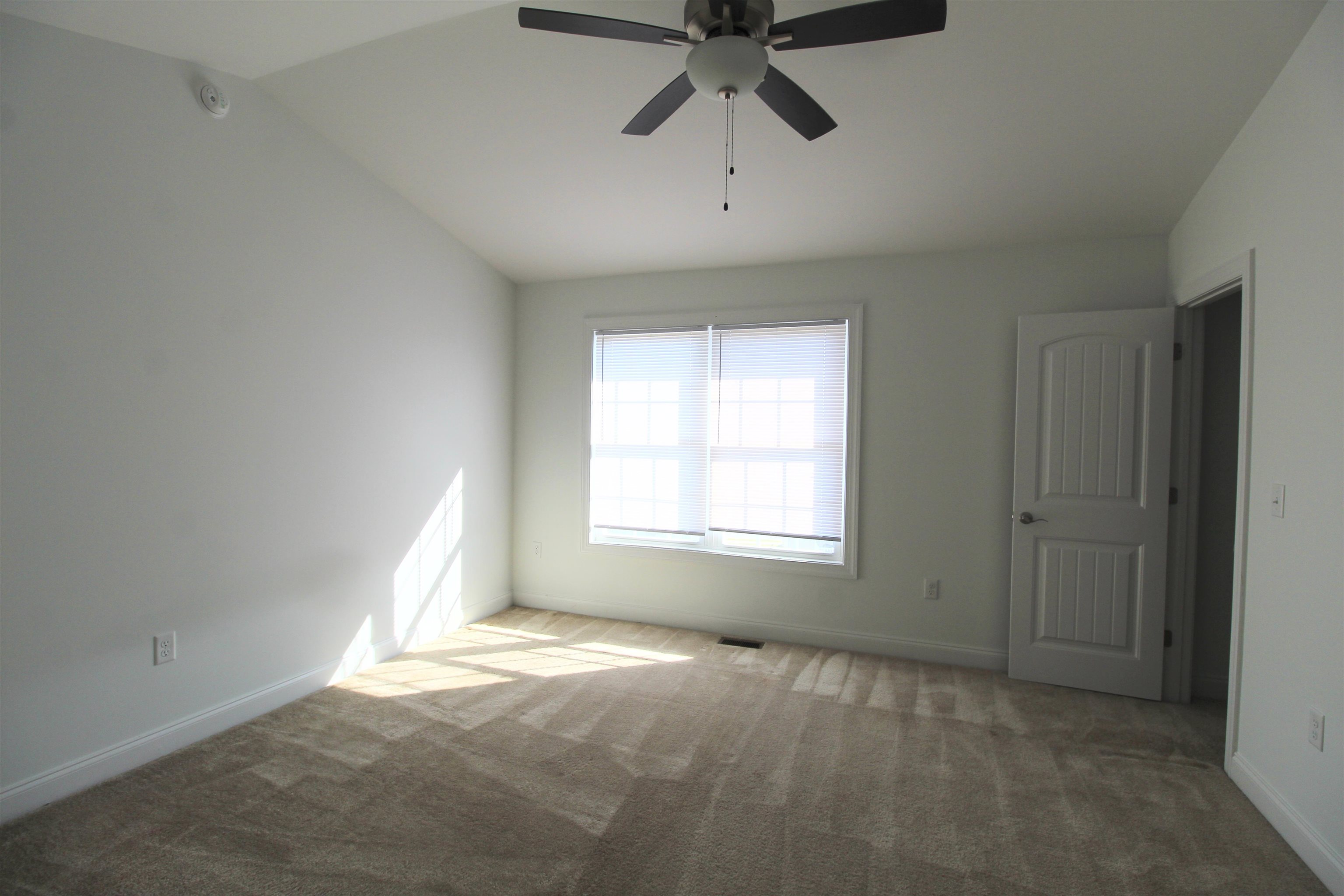 1145 Bluemoon Drive Harrisonburg, VA 22801 - Photo 7 of 18 an empty room with a window and a fan