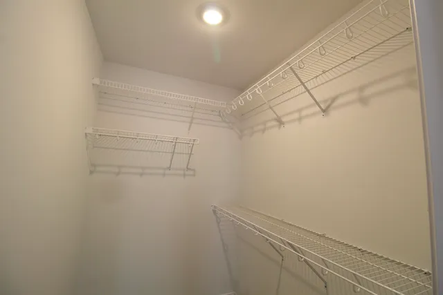 a view of a room with racks on the wall