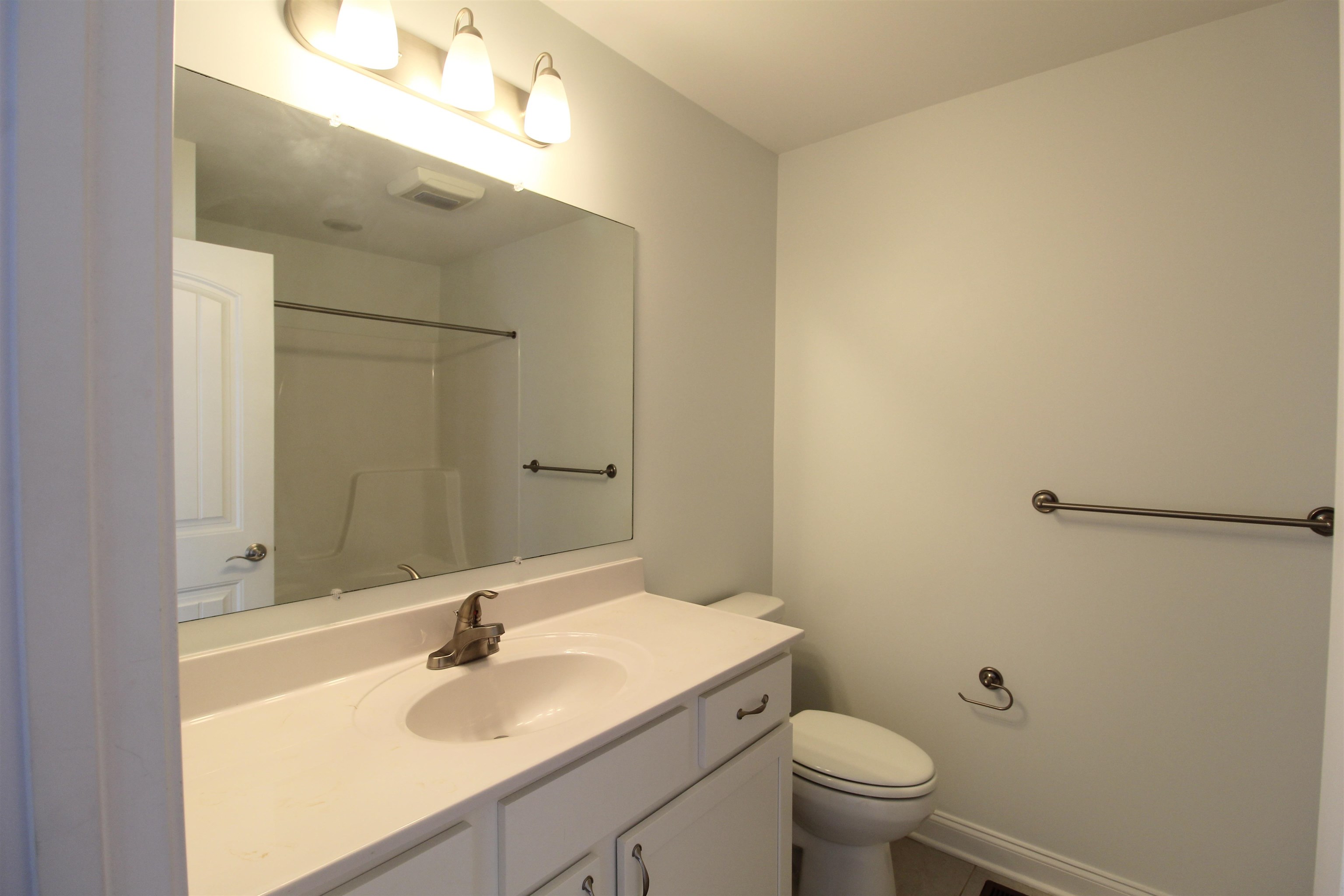 1145 Bluemoon Drive Harrisonburg, VA 22801 - Photo 10 of 18 a bathroom with a sink toilet and a mirror