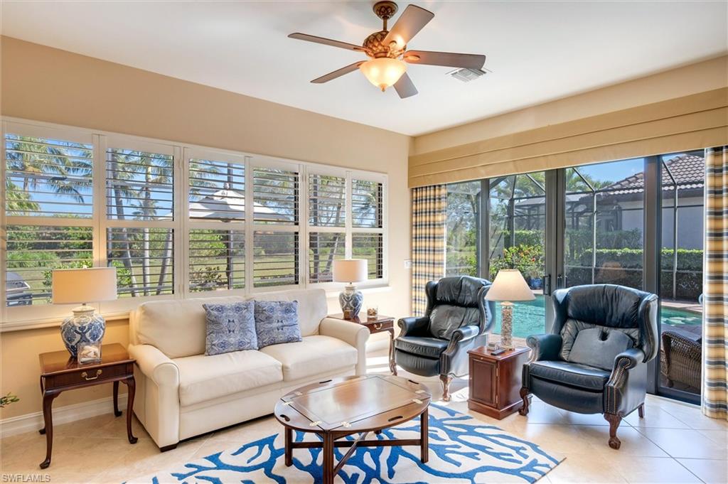7660 Cottesmore Drive Naples, FL 34113 - Photo 18 of 50 a living room with furniture and a large window