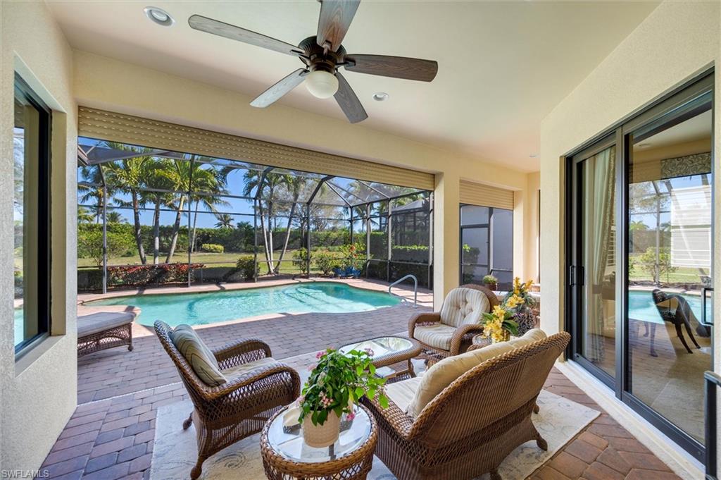 7660 Cottesmore Drive Naples, FL 34113 - Photo 22 of 50 a outdoor living space with furniture and a garden