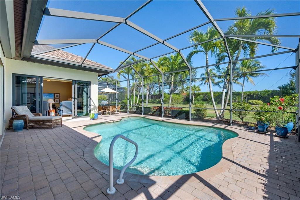 7660 Cottesmore Drive Naples, FL 34113 - Photo 24 of 50 a view of yard with patio