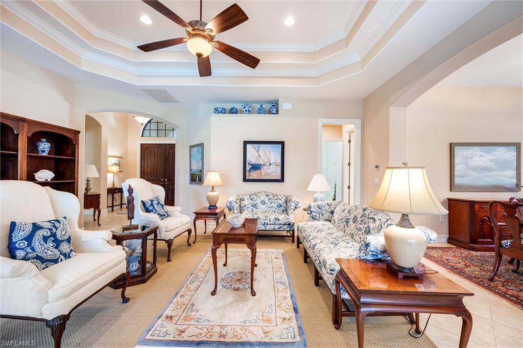 7660 Cottesmore Drive Naples, FL 34113 - Photo 4 of 50 a living room with furniture