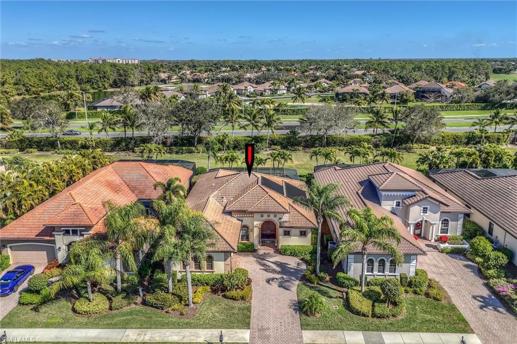 7660 Cottesmore Drive Naples, FL 34113 - Photo 6 of 50 an aerial view of residential houses with outdoor space and street view