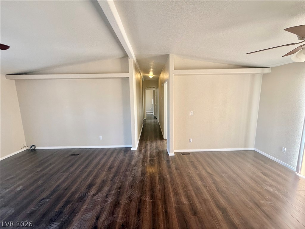 6450 Vicki Ann Road Pahrump, NV 89048 - Photo 5 of 9 Vast main living area features soaring vaulted ceilings and rich, durable flooring.
