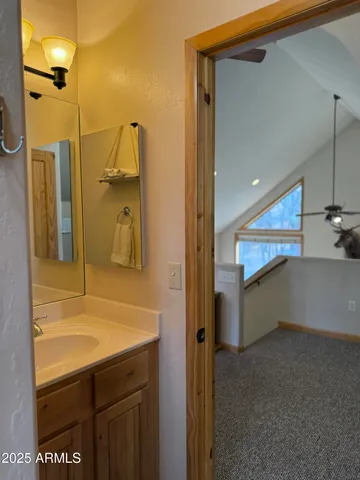 a living room with patio furniture and a floor to ceiling window
