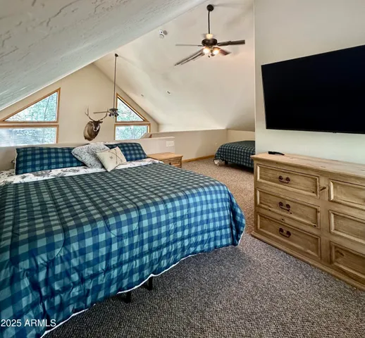 a living room with a couch and large windows