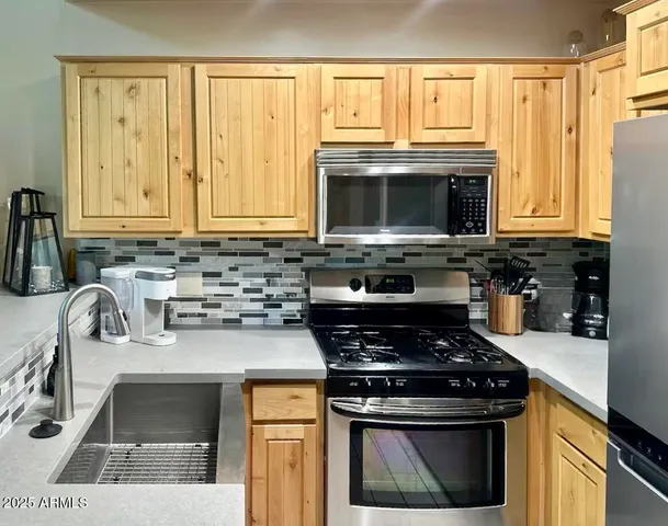 a bedroom with bed and window
