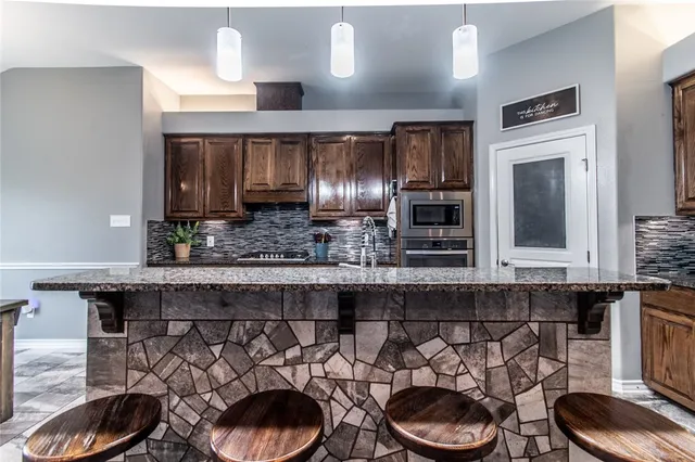a kitchen with a table and chairs in it