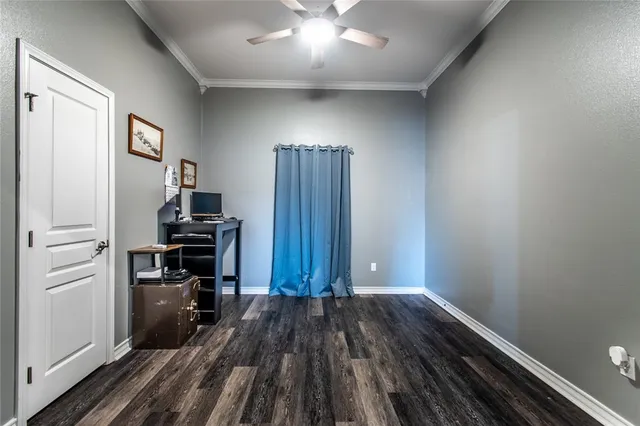 a view of kitchen and hallway with wooden floor