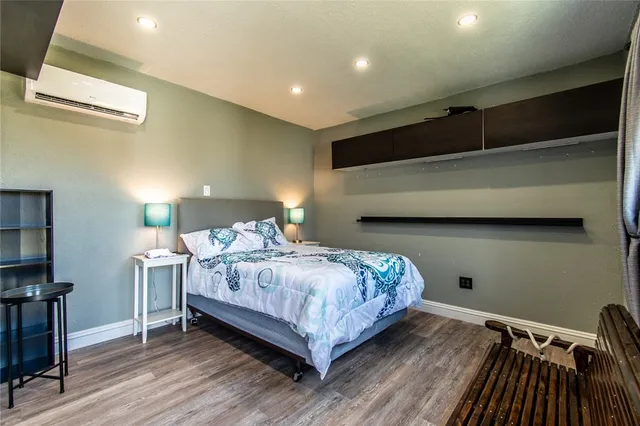 a bedroom with a bed and a night stand