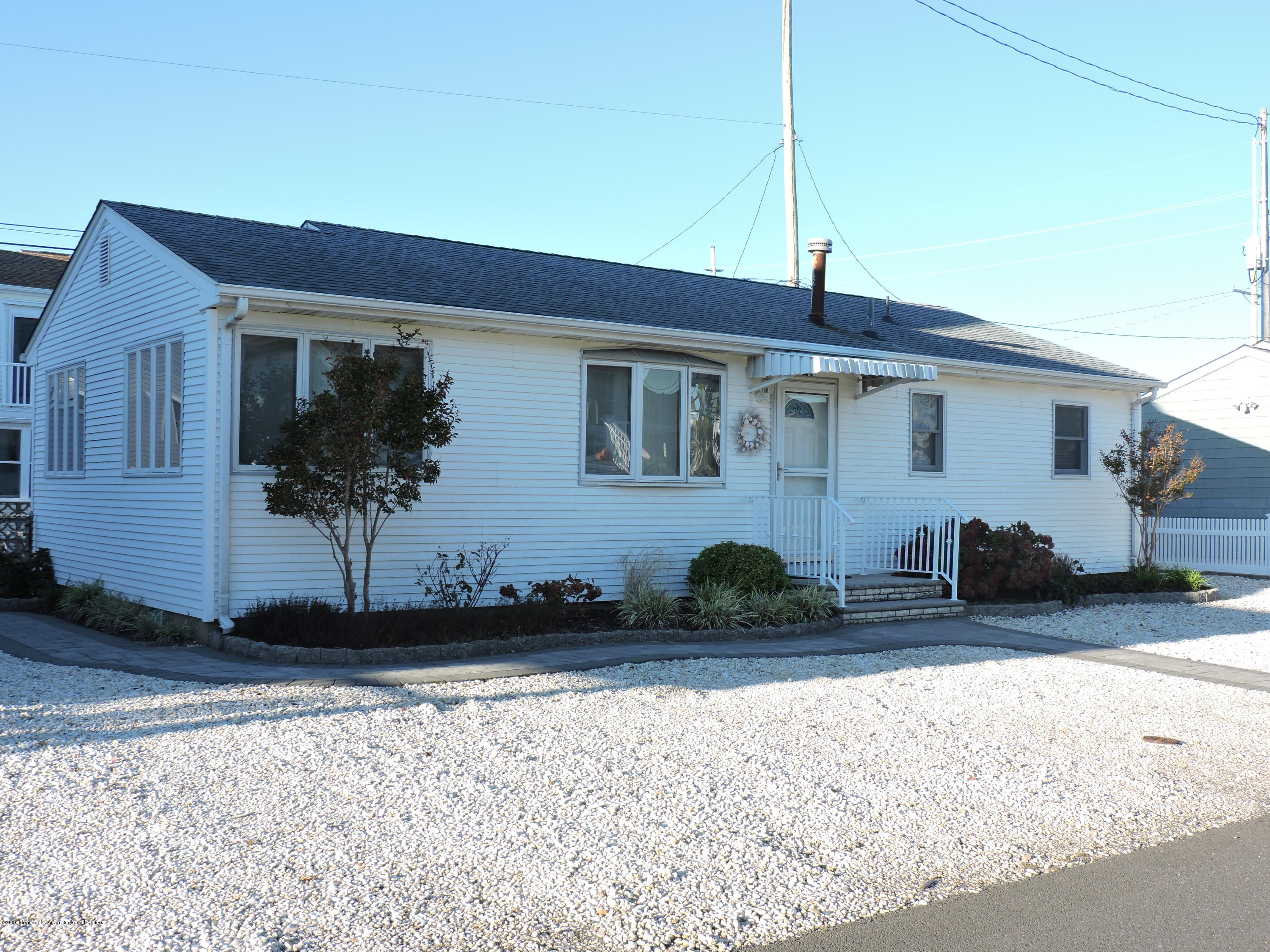121 Jacobsen Lane Lavallette, NJ 08735 - Photo 16 of 19 a front view of a house