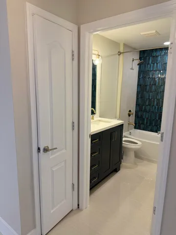 a bathroom with a bathtub a sink and a shower