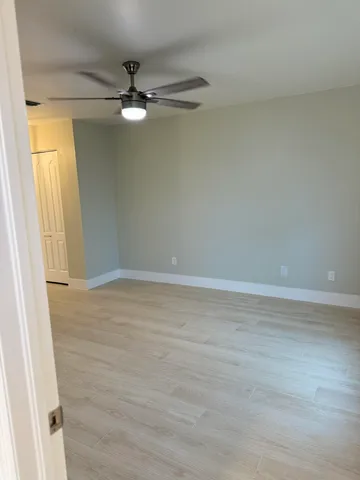 a view of an empty room with a window