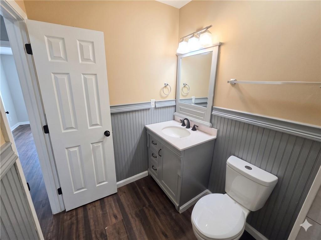 1929 Wee Kirk Road Southeast Atlanta, GA 30316 - Photo 13 of 22 a bathroom with a sink mirror vanity and toilet