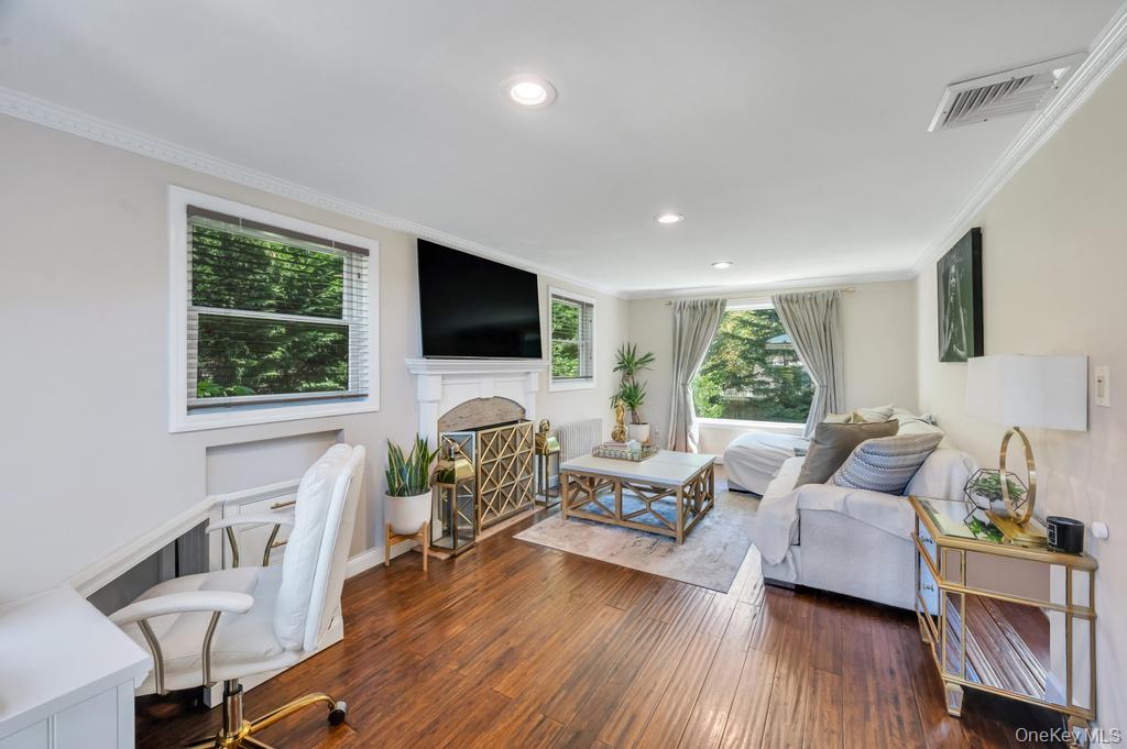 357 Wynsum Avenue Merrick, NY 11566 - Photo 12 of 40 a living room with furniture and a flat screen tv
