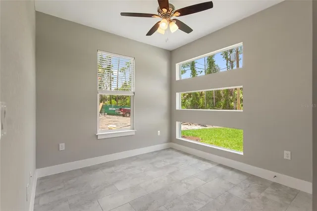 a view of an empty room with a window