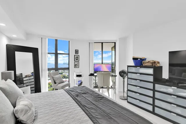 a bedroom with a bed and furniture