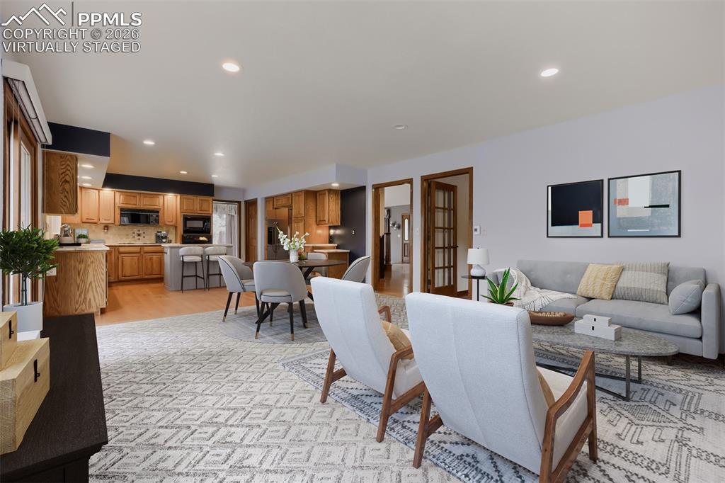 16755 Winchester Road Colorado Springs, CO 80908 - Photo 13 of 50 Virtually staged family room with breakfast nook and deck access.