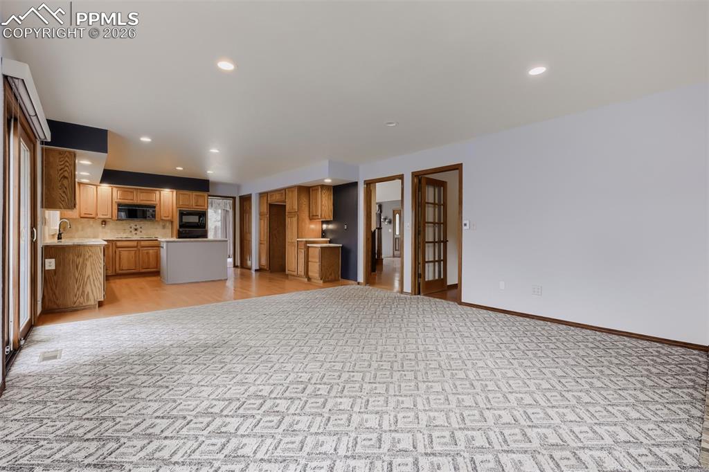 16755 Winchester Road Colorado Springs, CO 80908 - Photo 14 of 50 Family room with breakfast nook and deck access.
