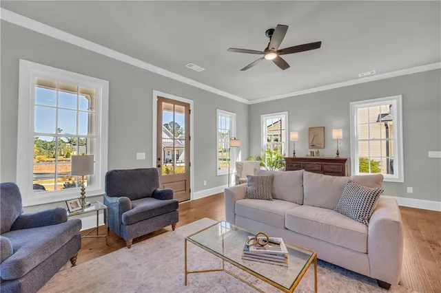 a living room with furniture and a large window