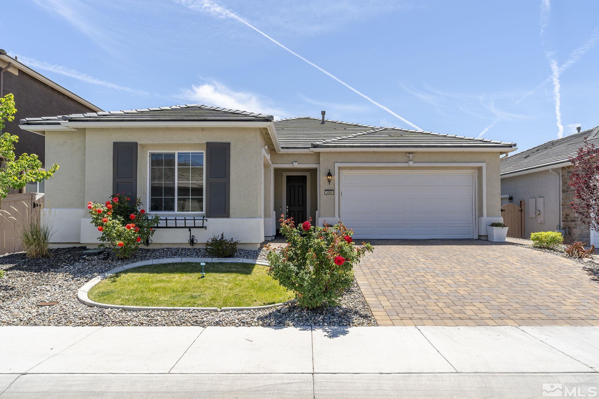 a view of a house with sitting area and a yard