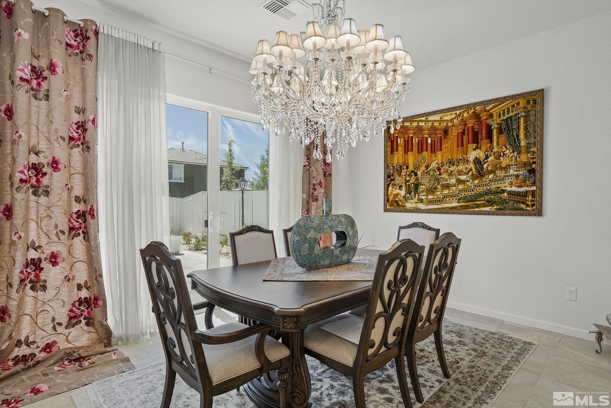 3080 Show Jumper Lane Reno, NV 89521 - Photo 15 of 40 a view of a dining room with furniture and chandelier