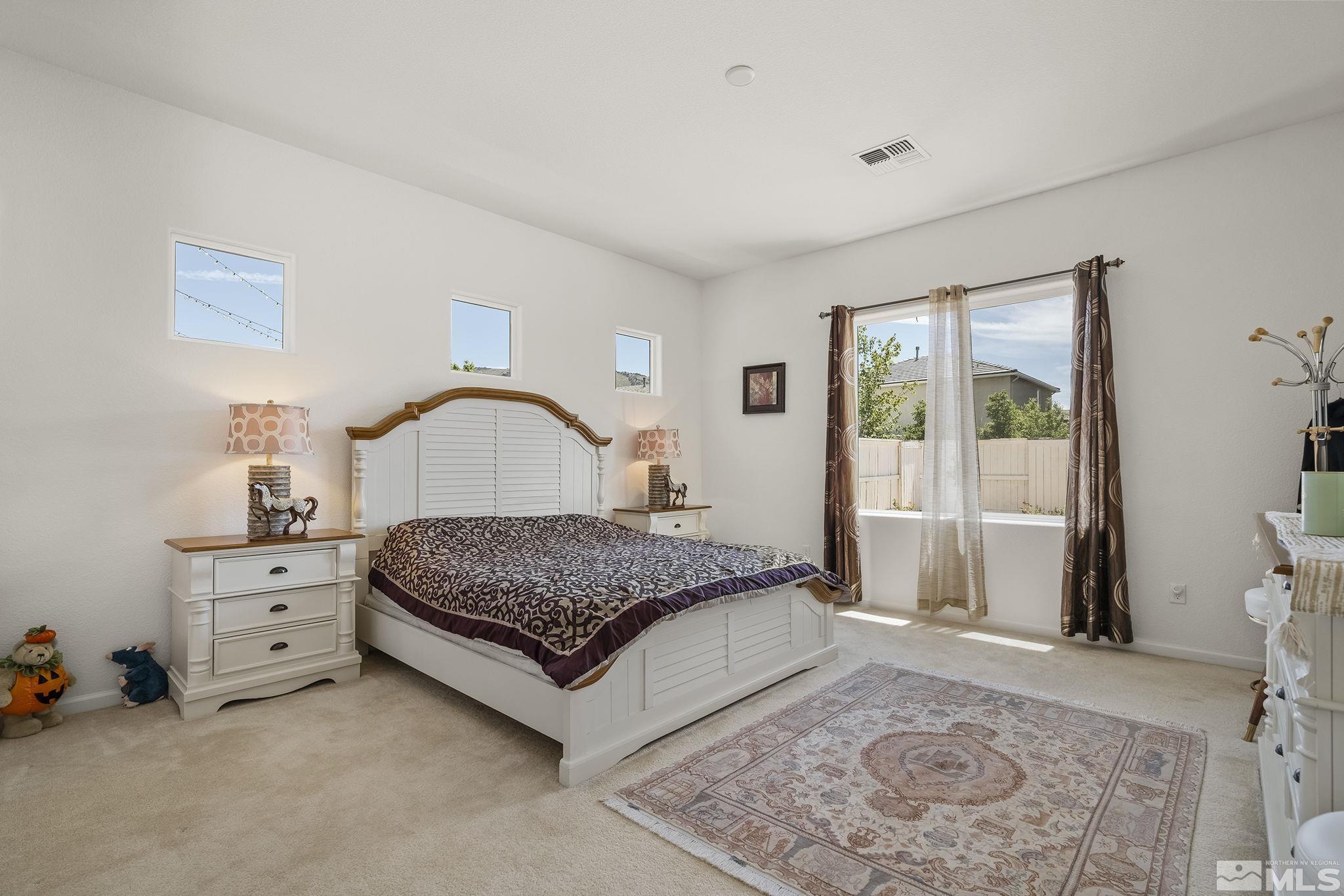 3080 Show Jumper Lane Reno, NV 89521 - Photo 16 of 40 a bedroom with a bed and window