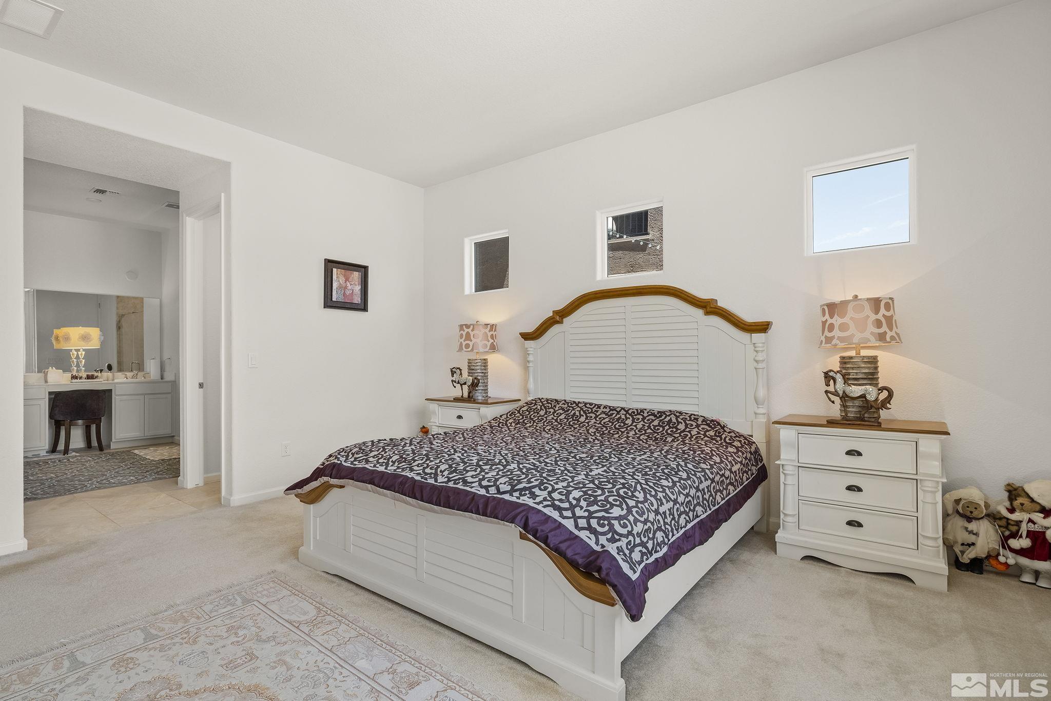 3080 Show Jumper Lane Reno, NV 89521 - Photo 17 of 40 a bedroom with a bed and a cabinets