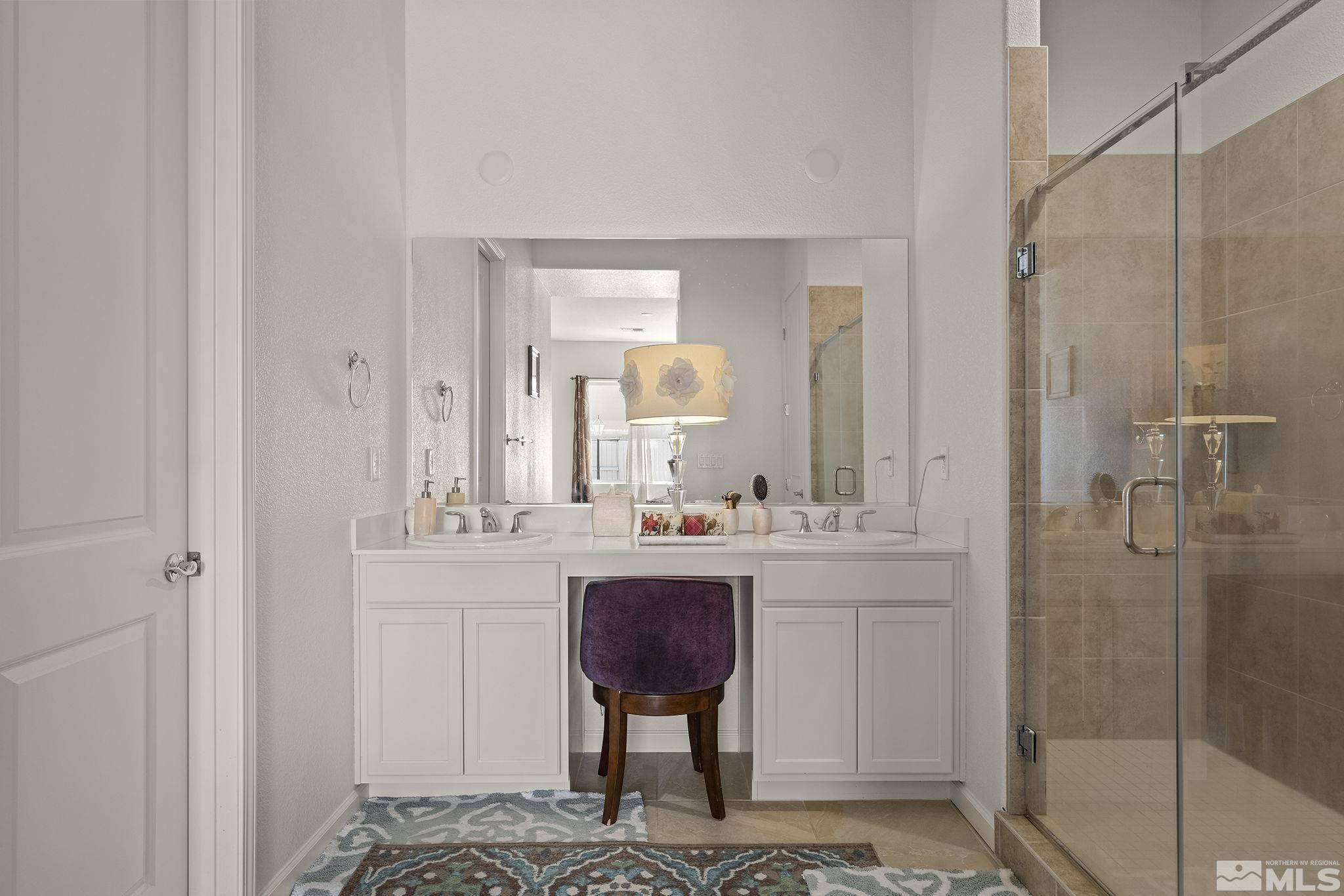 3080 Show Jumper Lane Reno, NV 89521 - Photo 18 of 40 a bathroom with a sink and a mirror