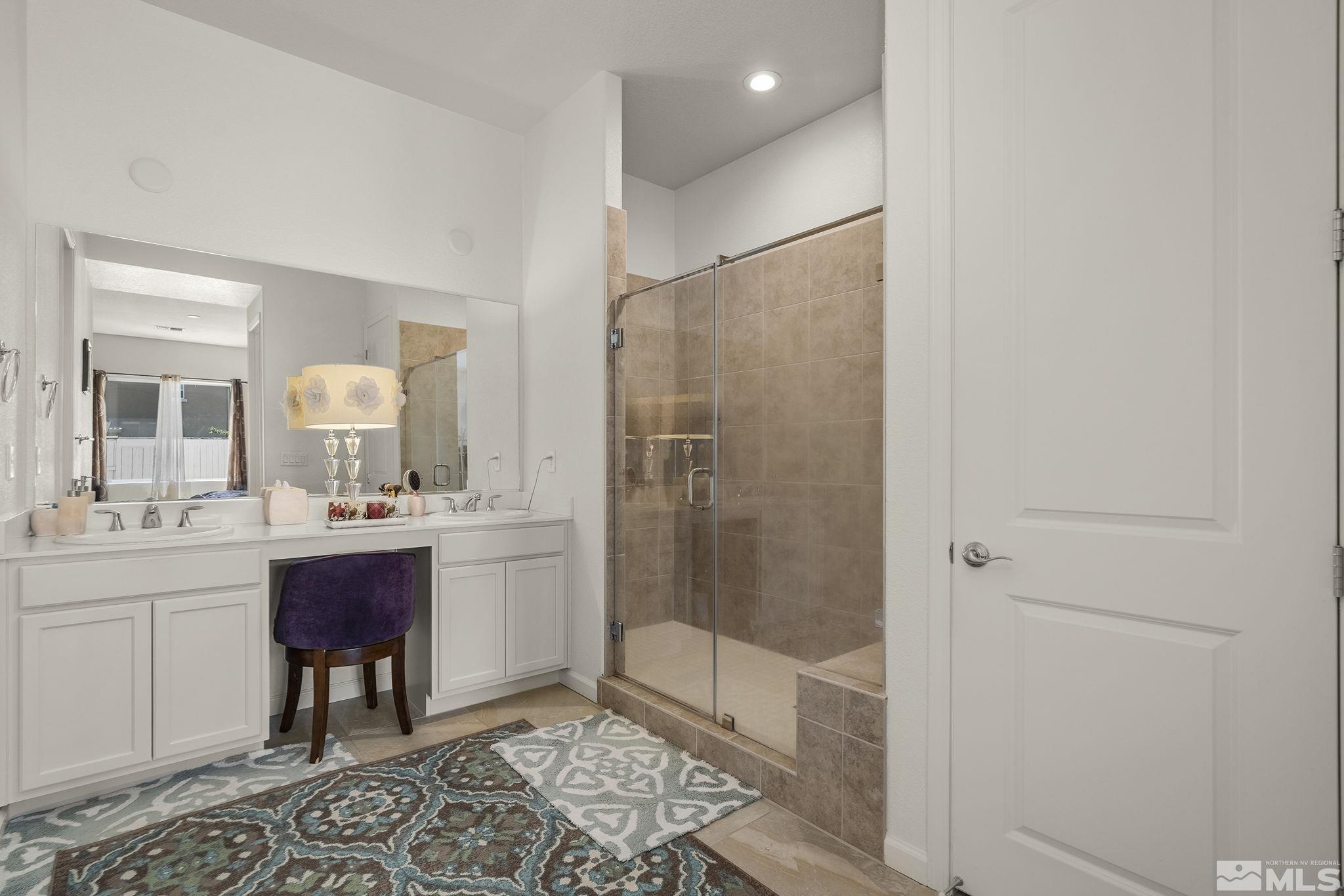3080 Show Jumper Lane Reno, NV 89521 - Photo 19 of 40 a bathroom with a sink and a mirror