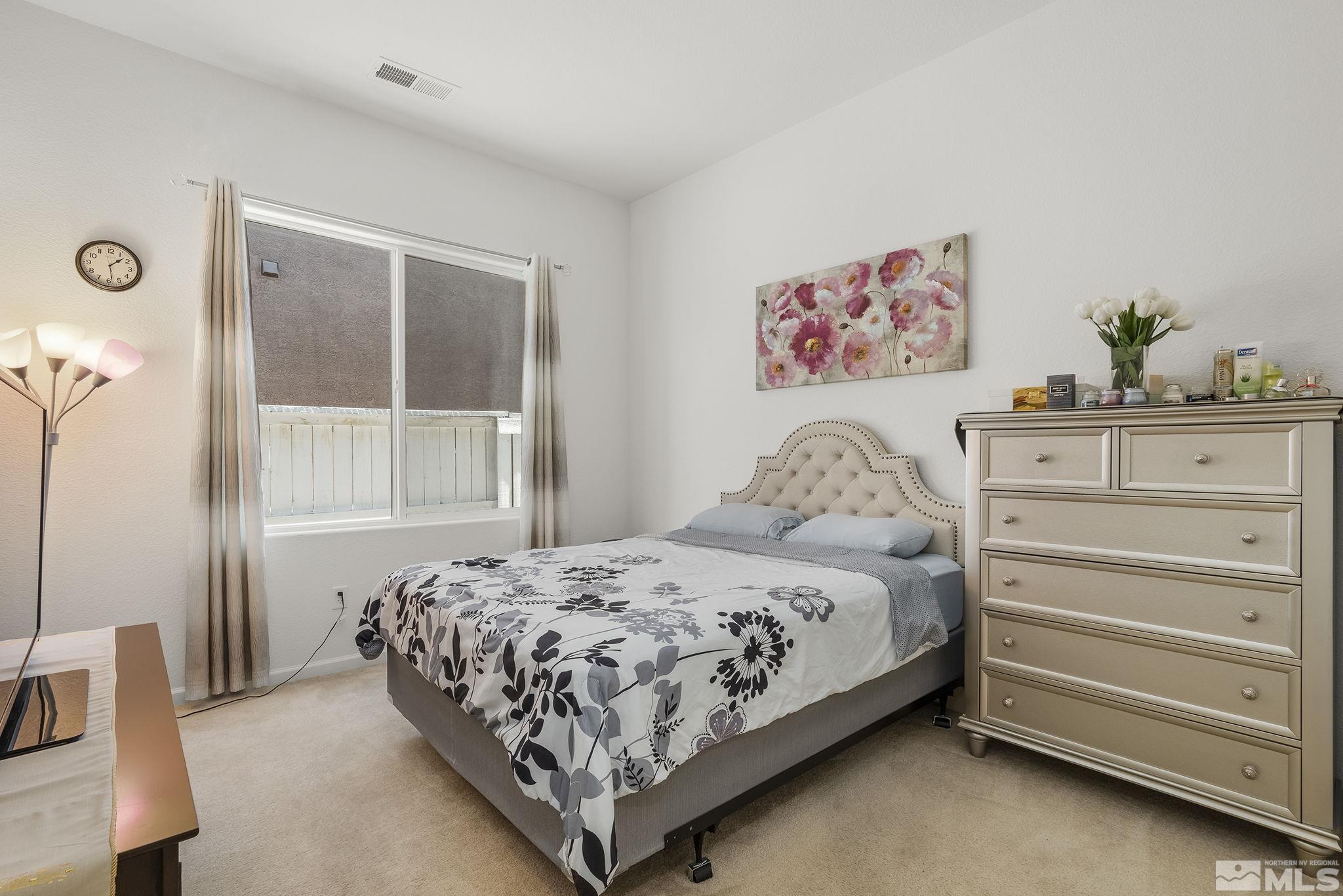 3080 Show Jumper Lane Reno, NV 89521 - Photo 21 of 40 a bedroom with a bed and a window