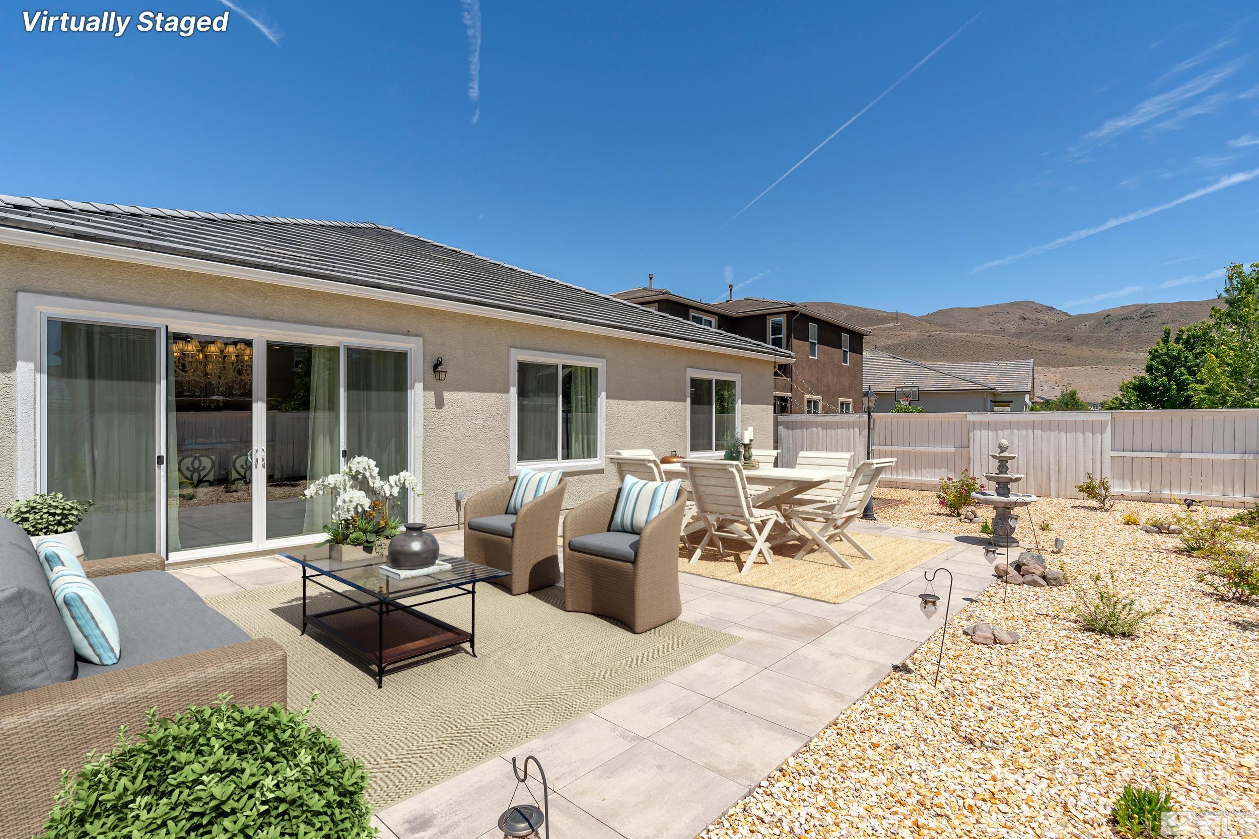 3080 Show Jumper Lane Reno, NV 89521 - Photo 24 of 40 a view of a patio with couches table and chairs and potted plants