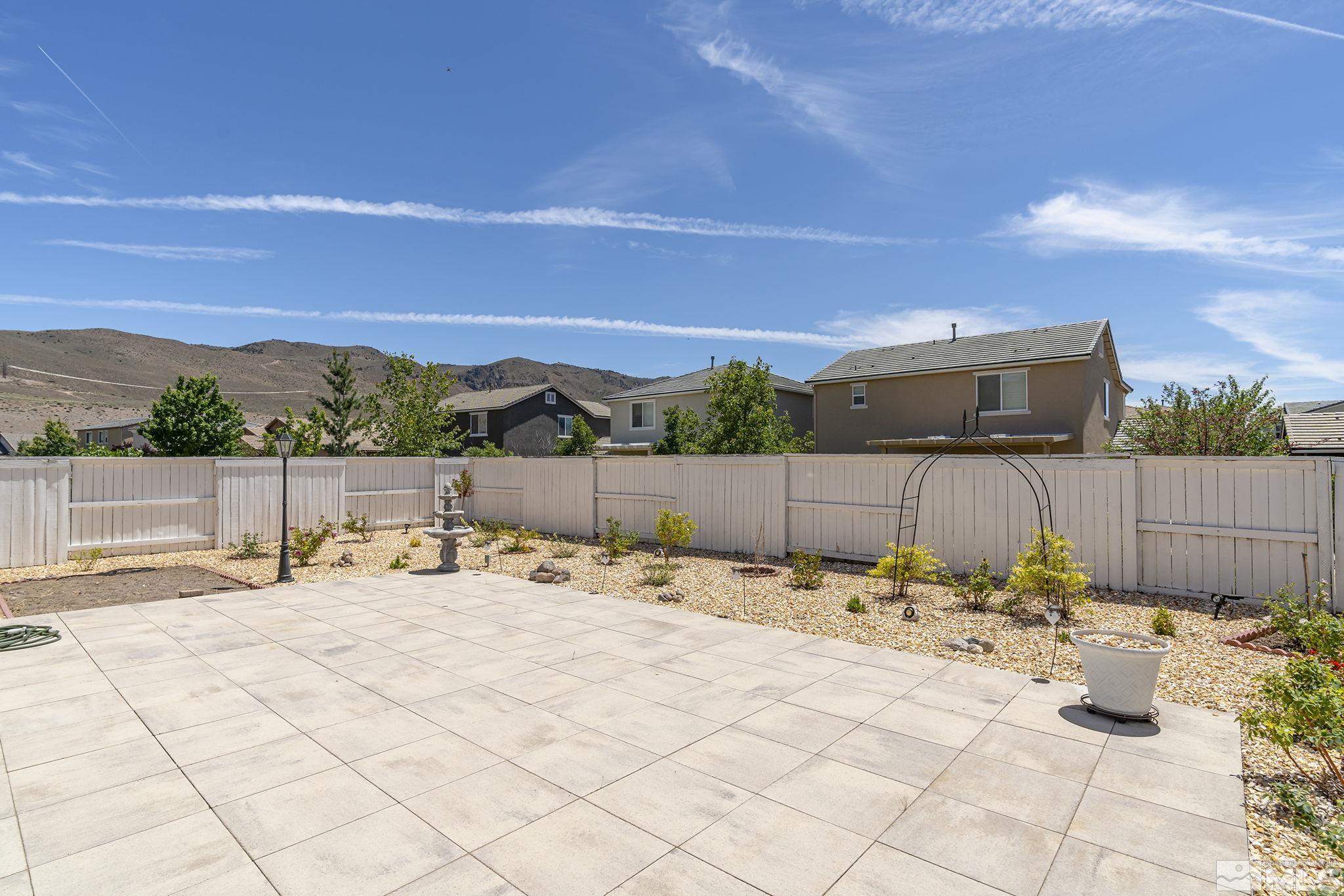 3080 Show Jumper Lane Reno, NV 89521 - Photo 27 of 40 a view of a terrace with a barbeque grill and wooden fence