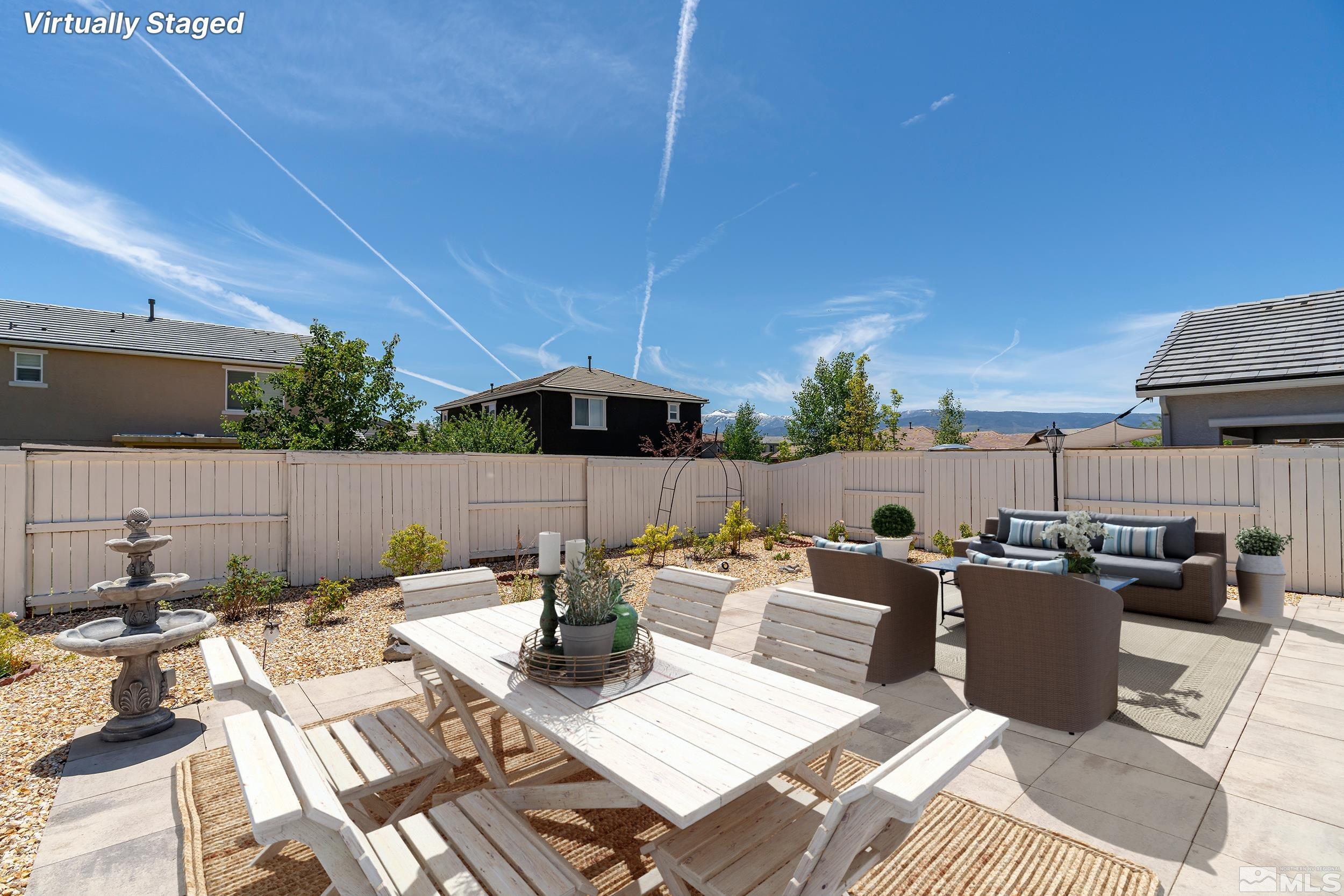 3080 Show Jumper Lane Reno, NV 89521 - Photo 28 of 40 a view of a patio with couches chairs potted plants and a table