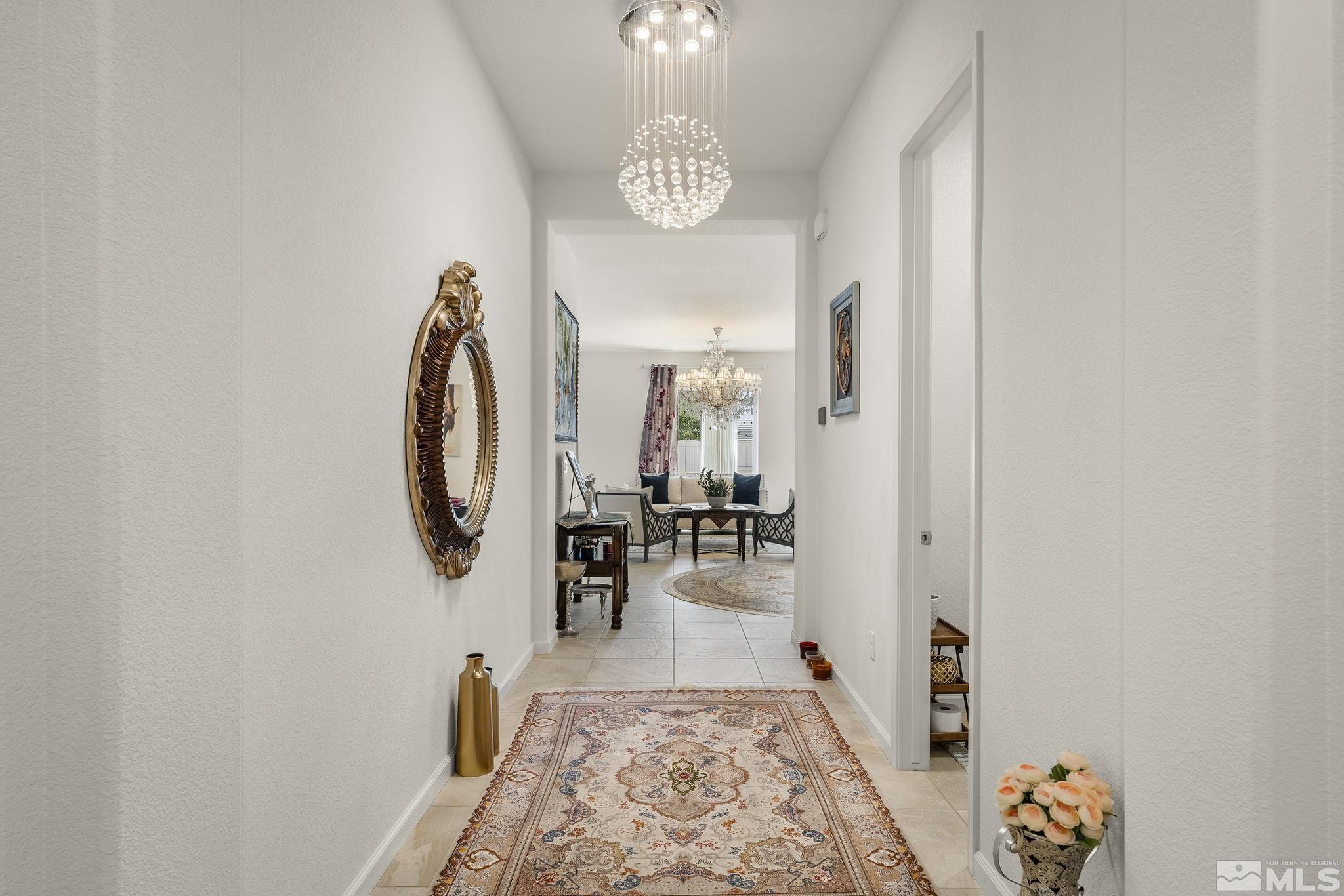 3080 Show Jumper Lane Reno, NV 89521 - Photo 3 of 40 an entryway with a table and chairs