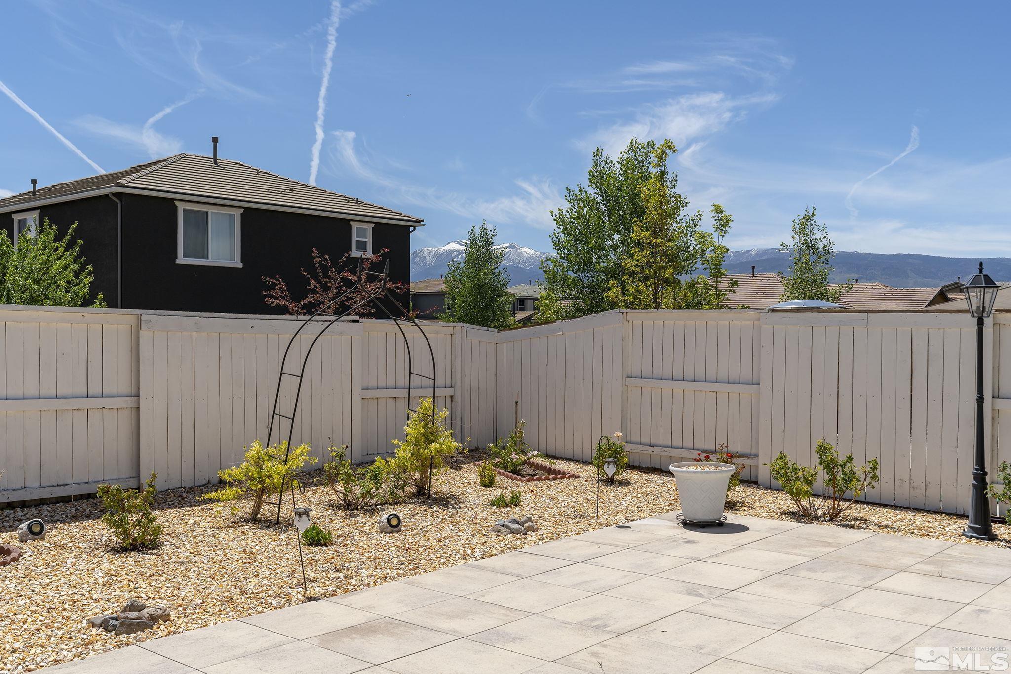 3080 Show Jumper Lane Reno, NV 89521 - Photo 31 of 40 a view of a dinning table and chairs in a backyard
