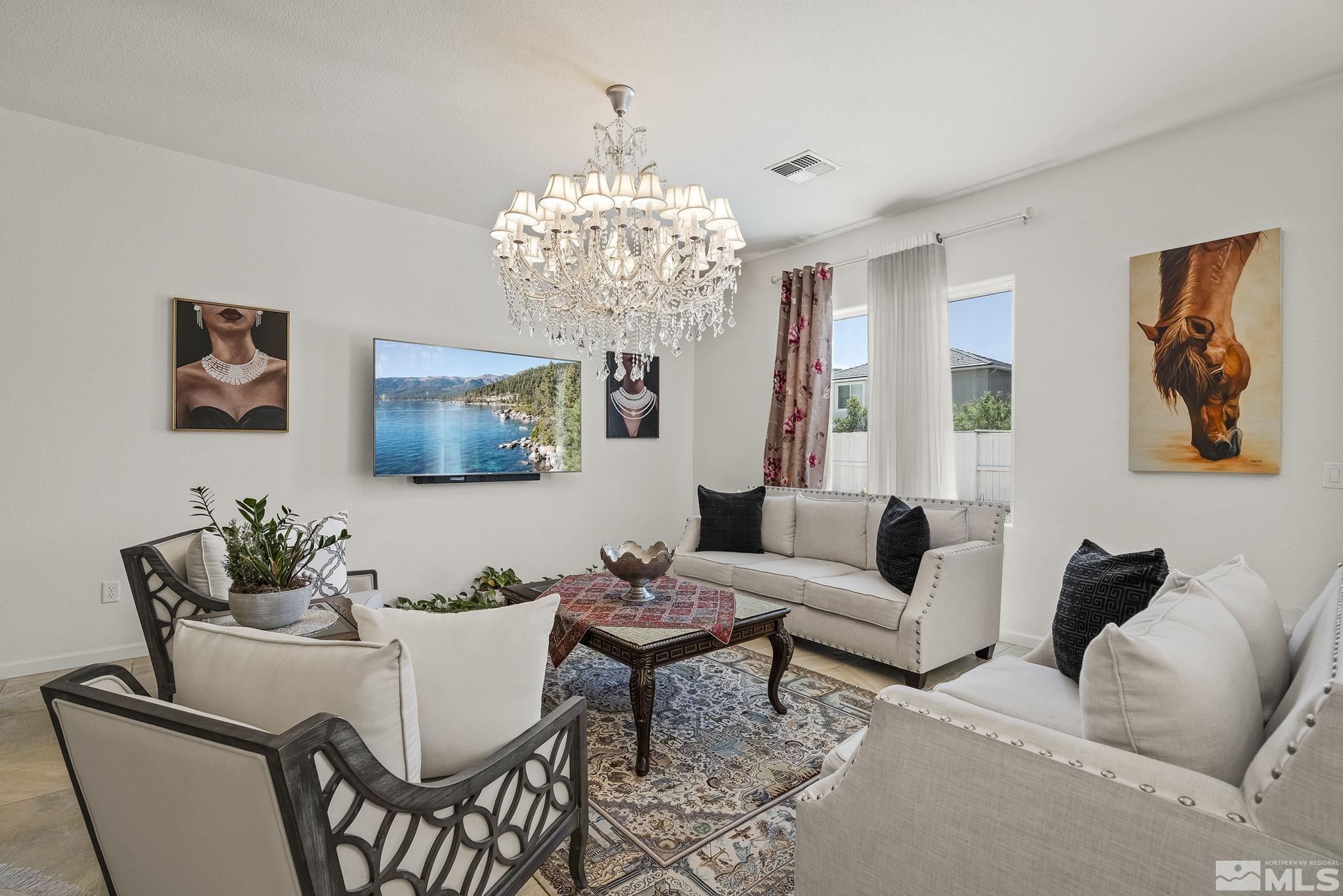 3080 Show Jumper Lane Reno, NV 89521 - Photo 6 of 40 a living room with furniture and a chandelier