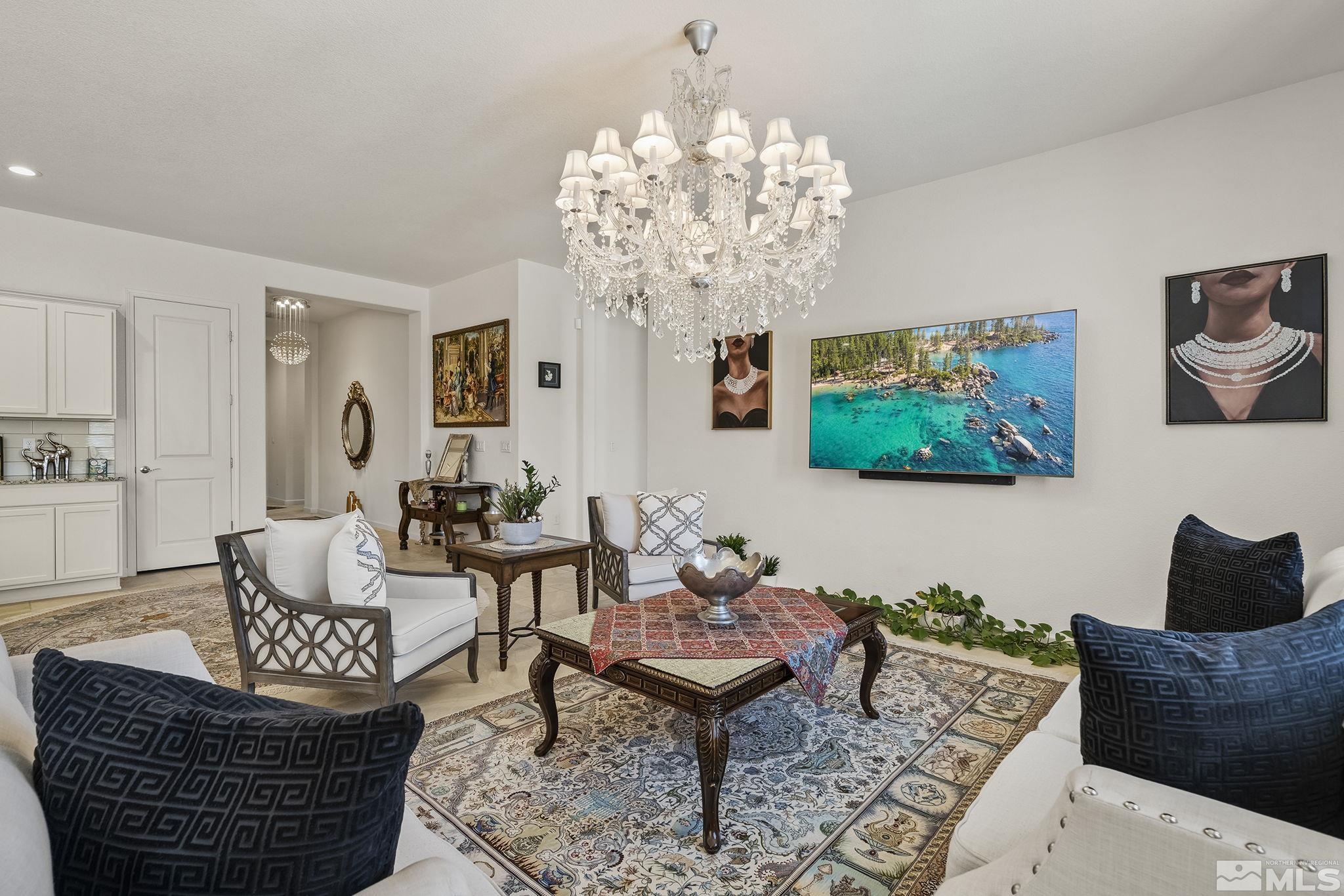 3080 Show Jumper Lane Reno, NV 89521 - Photo 7 of 40 a living room with furniture a chandelier and a window