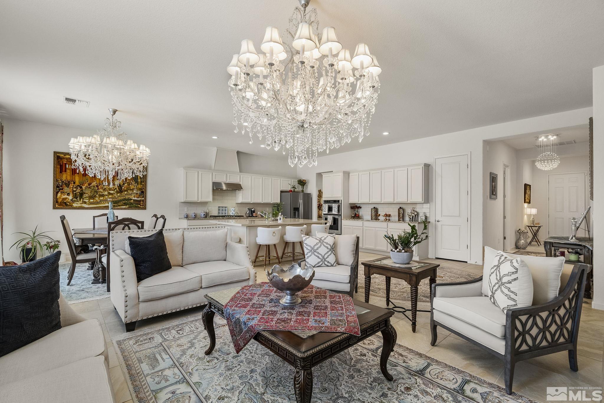 3080 Show Jumper Lane Reno, NV 89521 - Photo 8 of 40 a living room with furniture and a chandelier