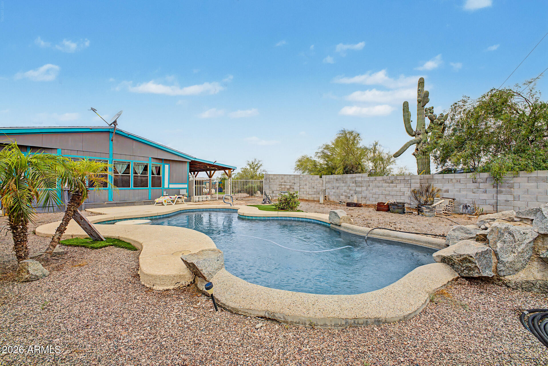 2548 South Val Vista Road Apache Junction, AZ 85119 - Photo 1 of 29 a view of a swimming pool with a patio and a yard