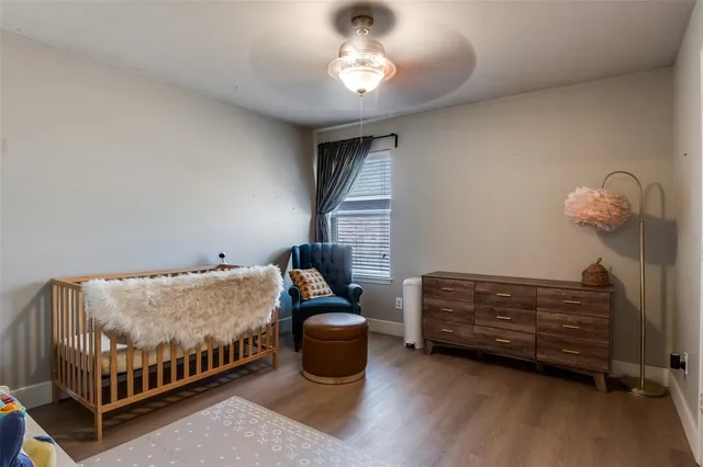 a bathroom with a granite countertop toilet a sink and a mirror