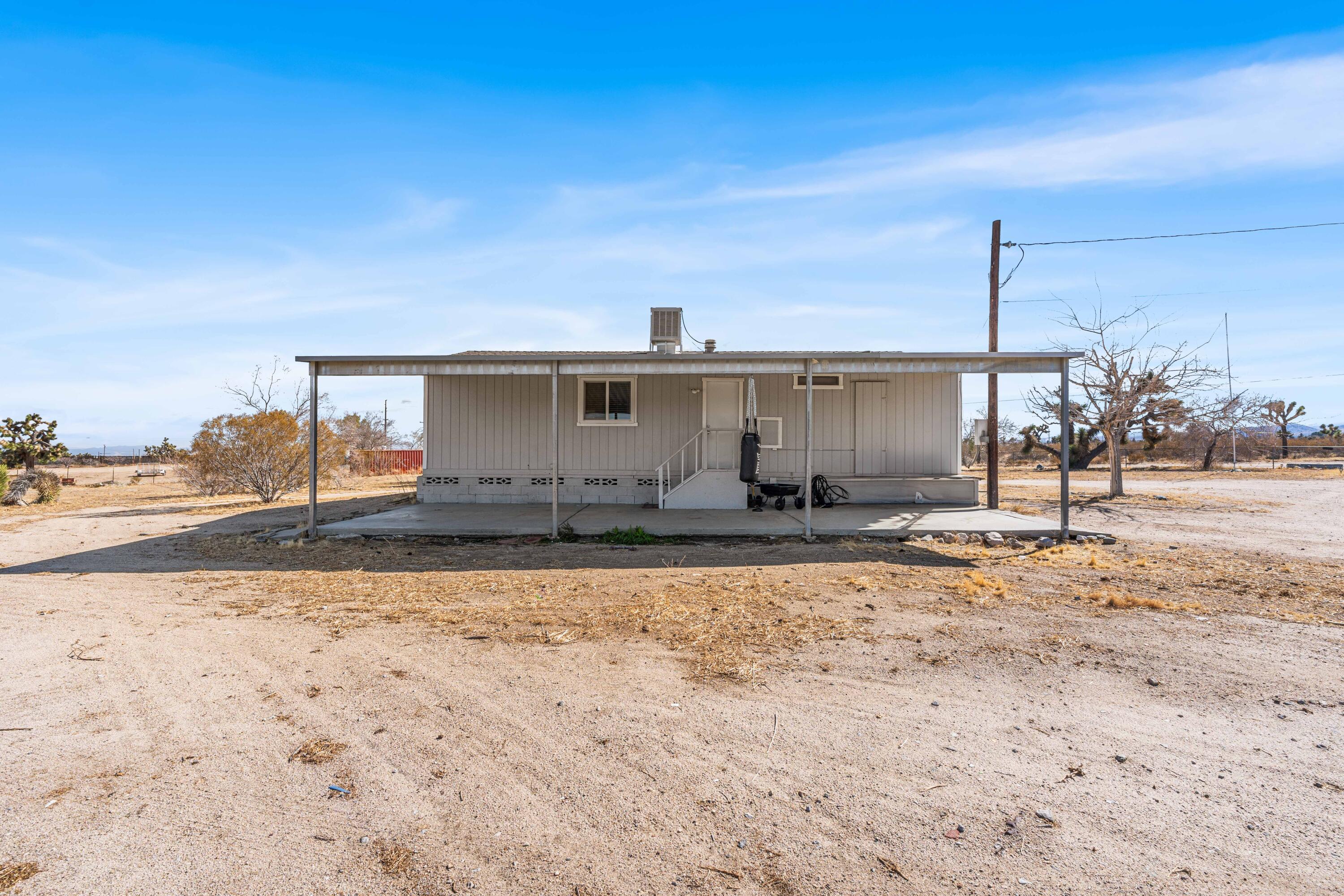 4824 Sacramento Road Phelan, CA 92371 - Photo 21 of 28 a view of a house with a patio