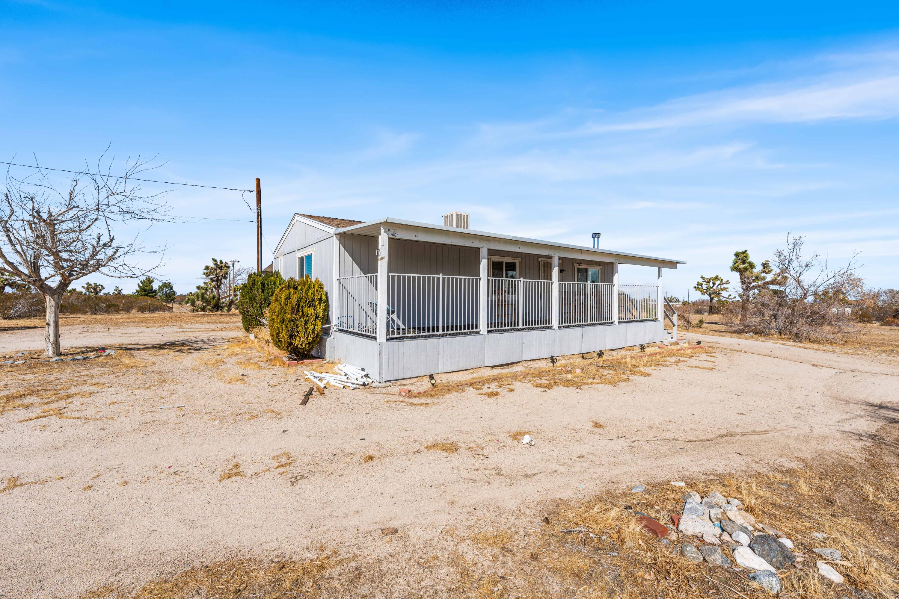 4824 Sacramento Road Phelan, CA 92371 - Photo 5 of 28 a view of a house with snow on the road